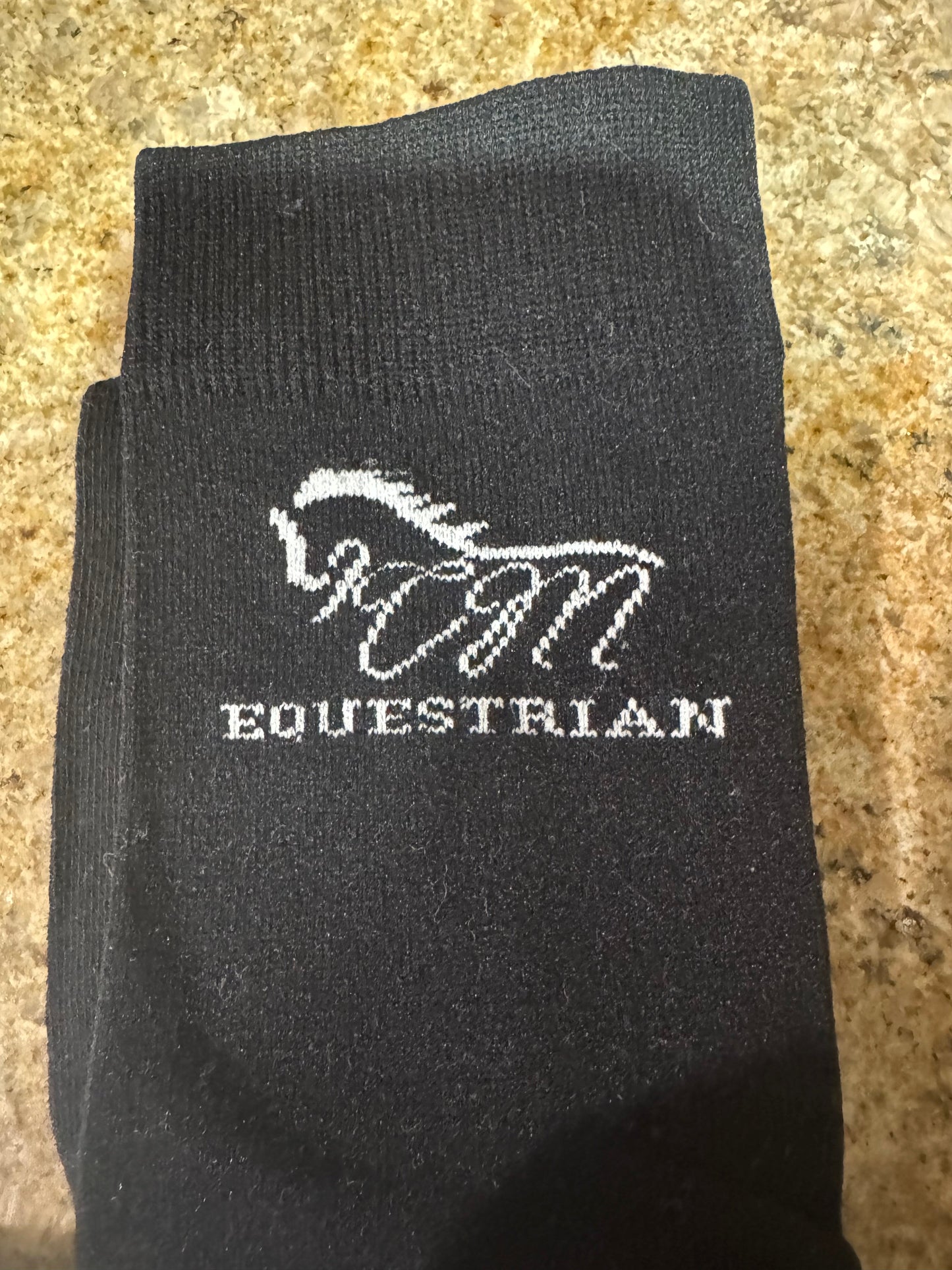 CM equestrian logo socks in black with White logo on the side.