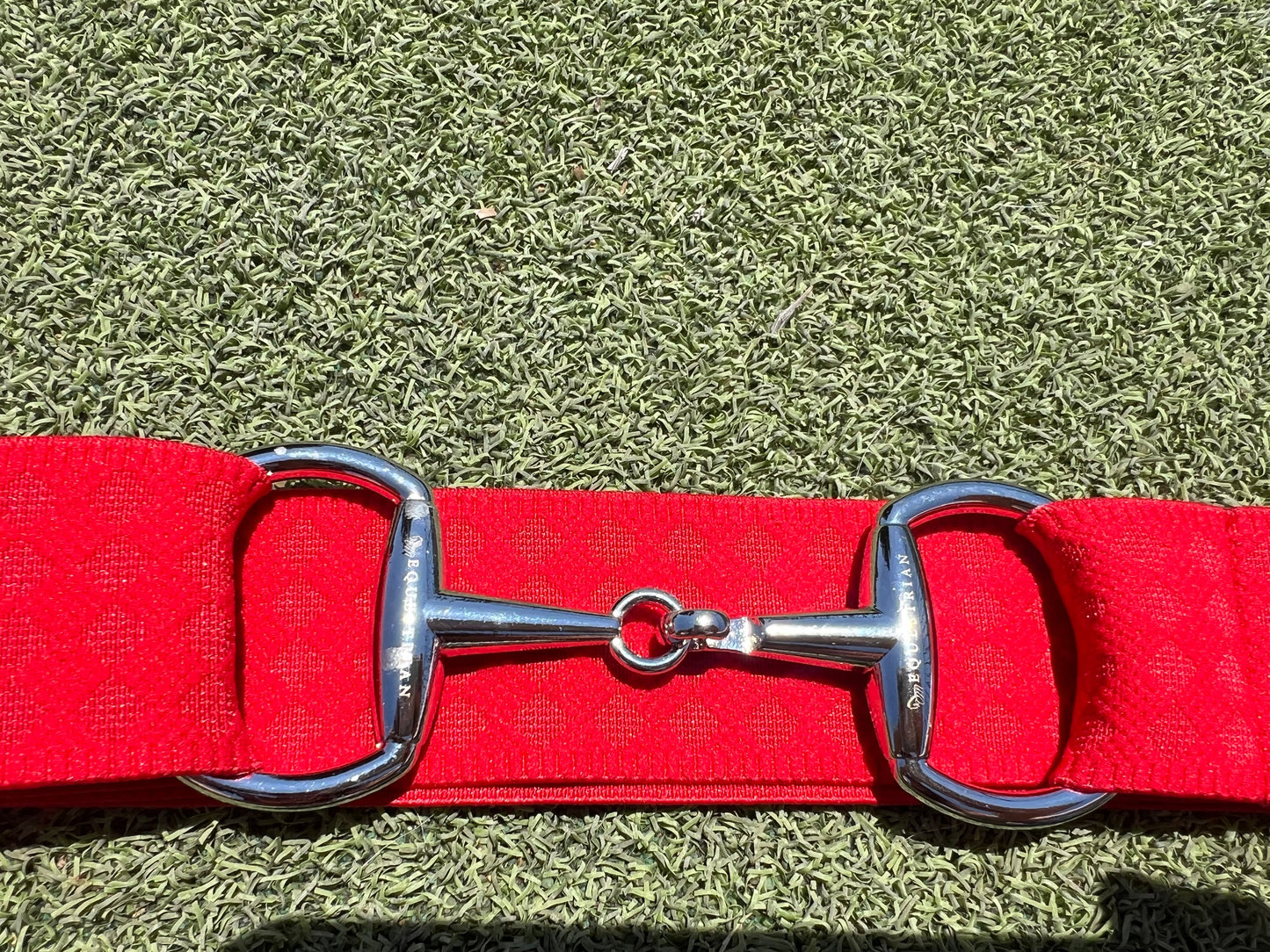 Red snaffle belt buckle with adjustable