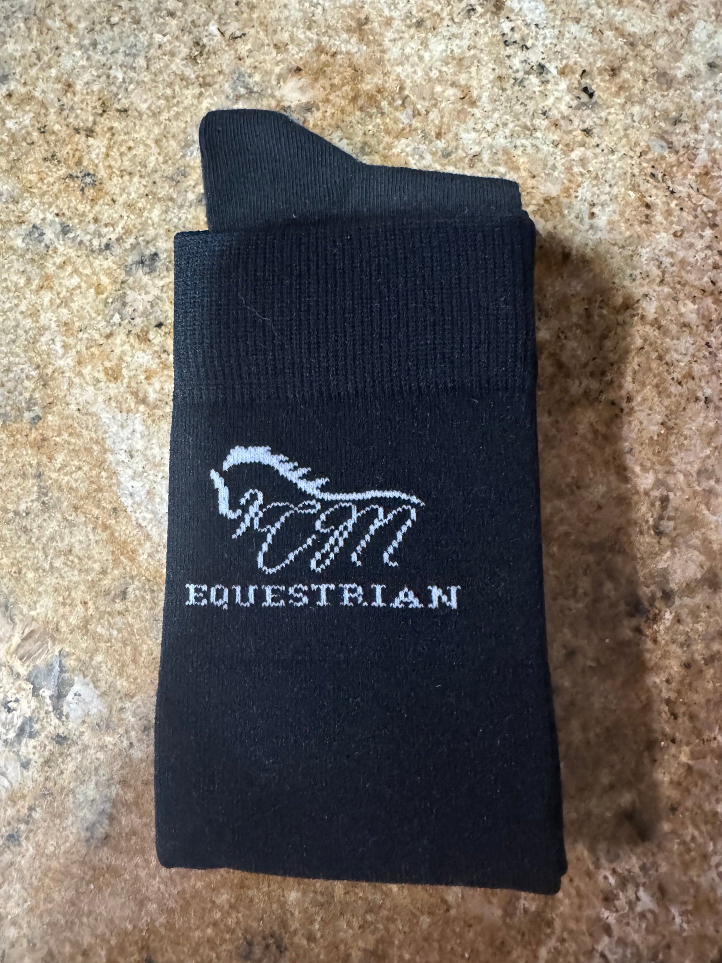 CM equestrian logo socks in black with White logo on the side.