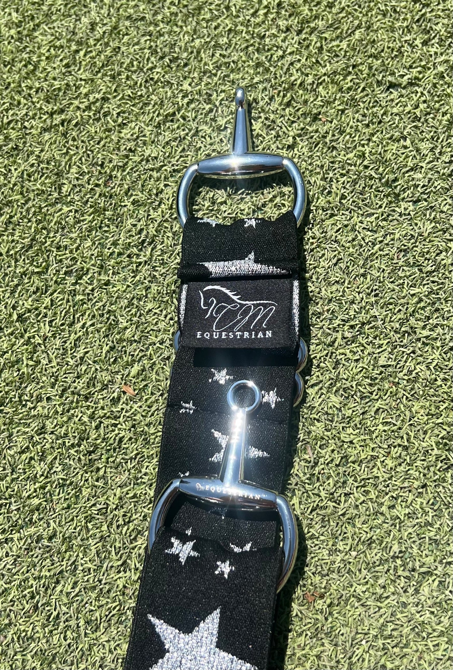 Star silver and black snaffle belt buckle with adjustable